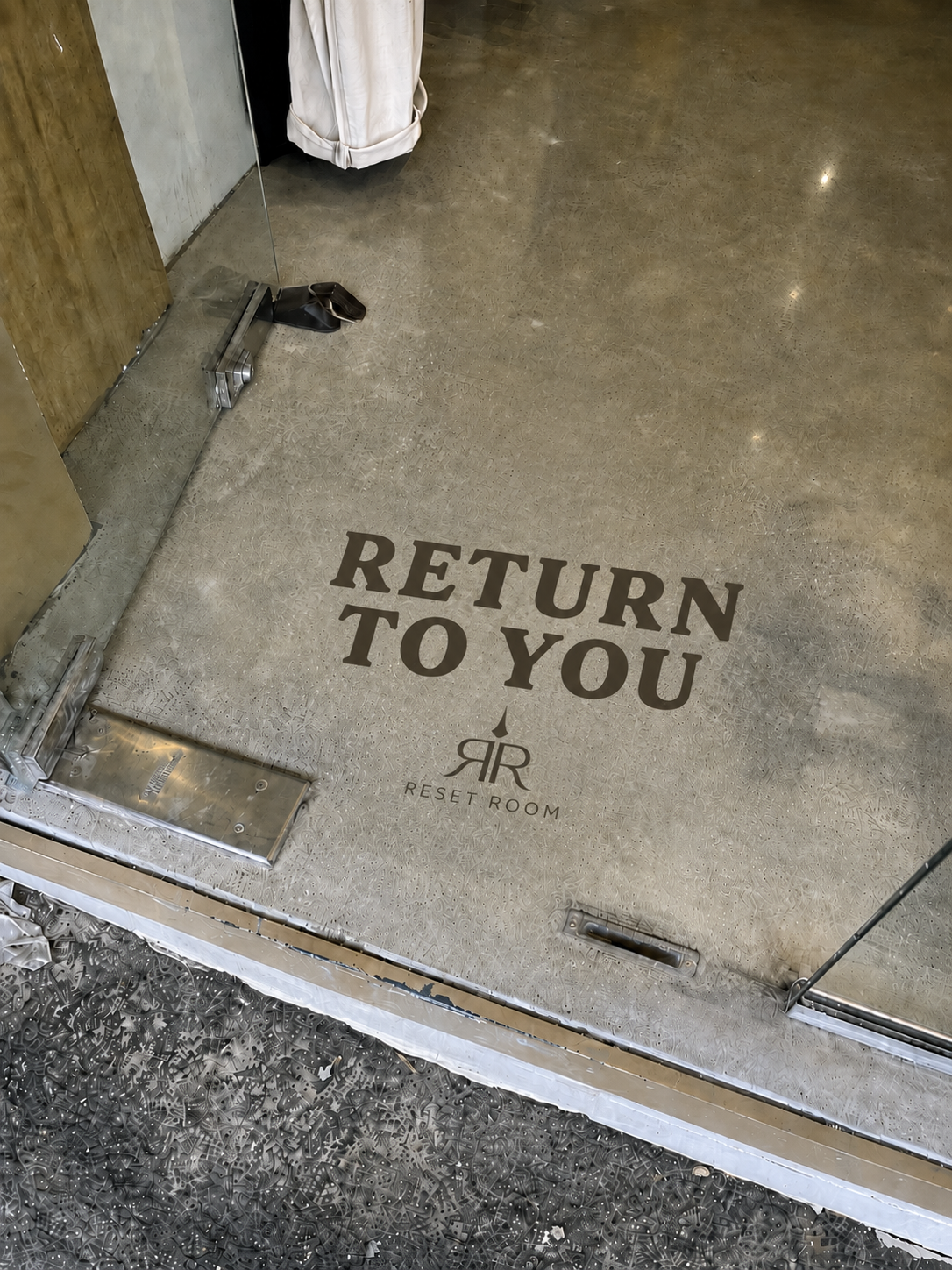 Return to you — Reset Room floor stamp at the entrance